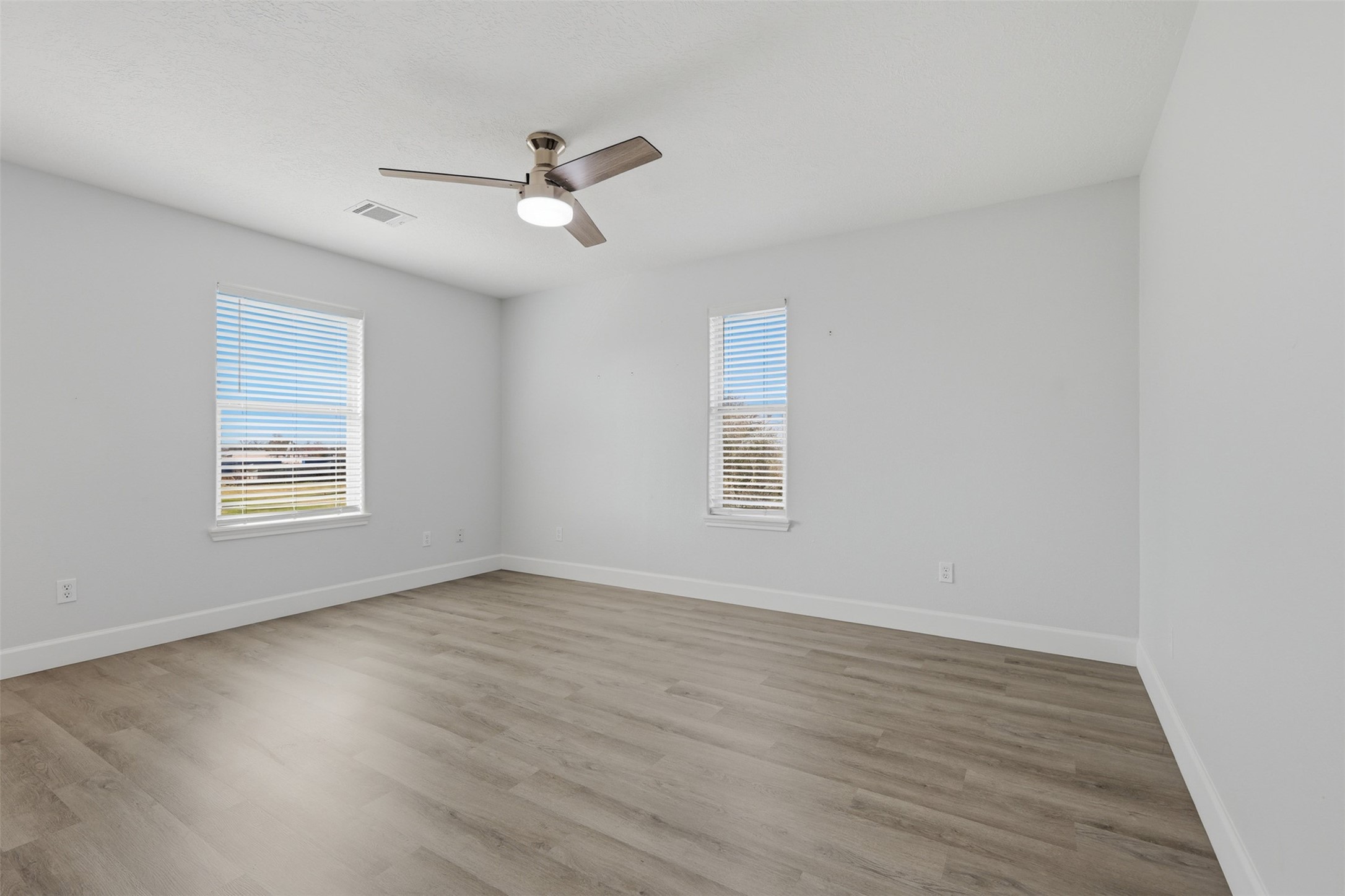9026 McGallion Road Houston, TX 77022 - Photo 26 of 35 wooden floor in an empty room with a window