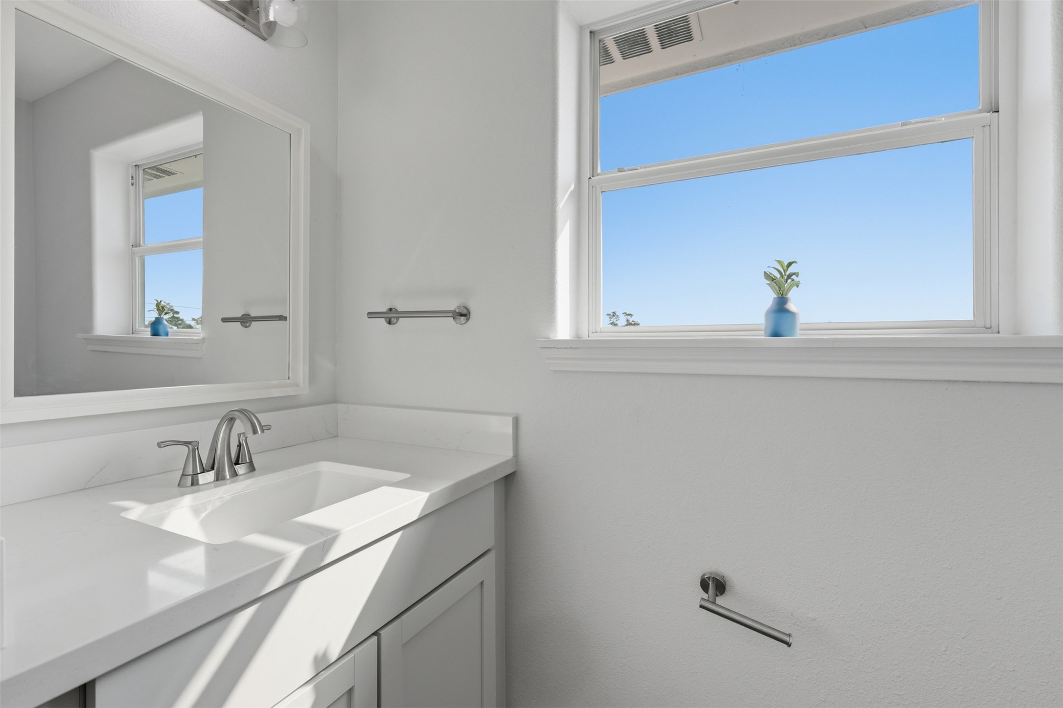 9026 McGallion Road Houston, TX 77022 - Photo 30 of 35 a bathroom with a sink and a mirror