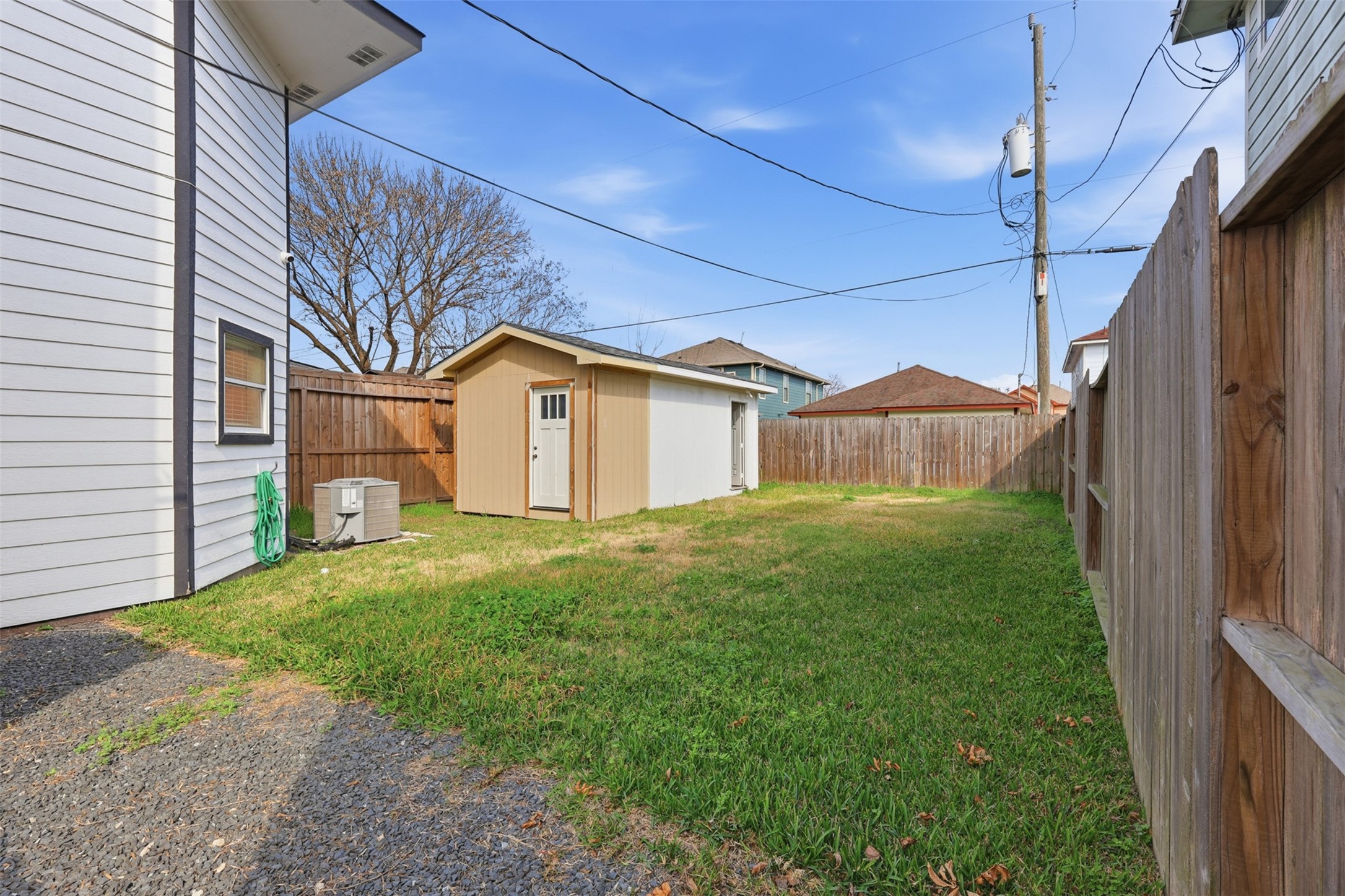 9026 McGallion Road Houston, TX 77022 - Photo 32 of 35 a view of a house with a back yard
