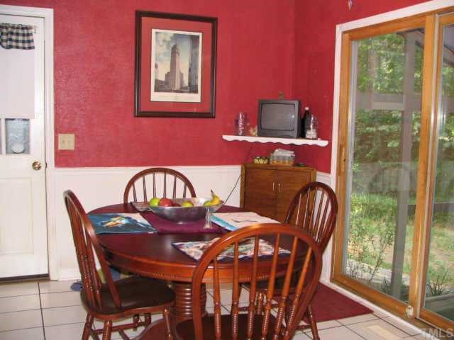 1710 Cranston Road Garner, NC 27529 - Photo 3 of 7 a view of a dining room with furniture wooden floor and balcony