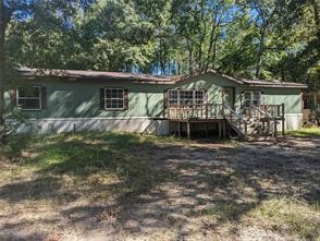 12186 Hairston Circle Willis, TX 77318 - Photo 1 of 16 a view of a house with a yard