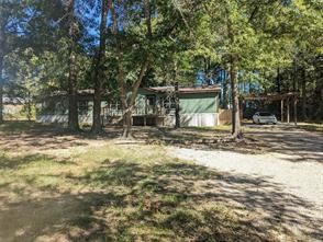 12186 Hairston Circle Willis, TX 77318 - Photo 15 of 16 a backyard of a house with barbeque oven