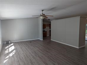 12186 Hairston Circle Willis, TX 77318 - Photo 16 of 16 a view of empty room with wooden floor and ceiling fan