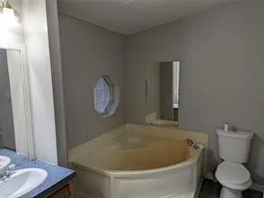 a bathroom with a toilet and a sink