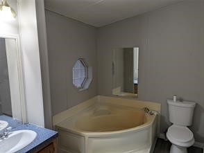 12186 Hairston Circle Willis, TX 77318 - Photo 7 of 16 a bathroom with a toilet and a sink