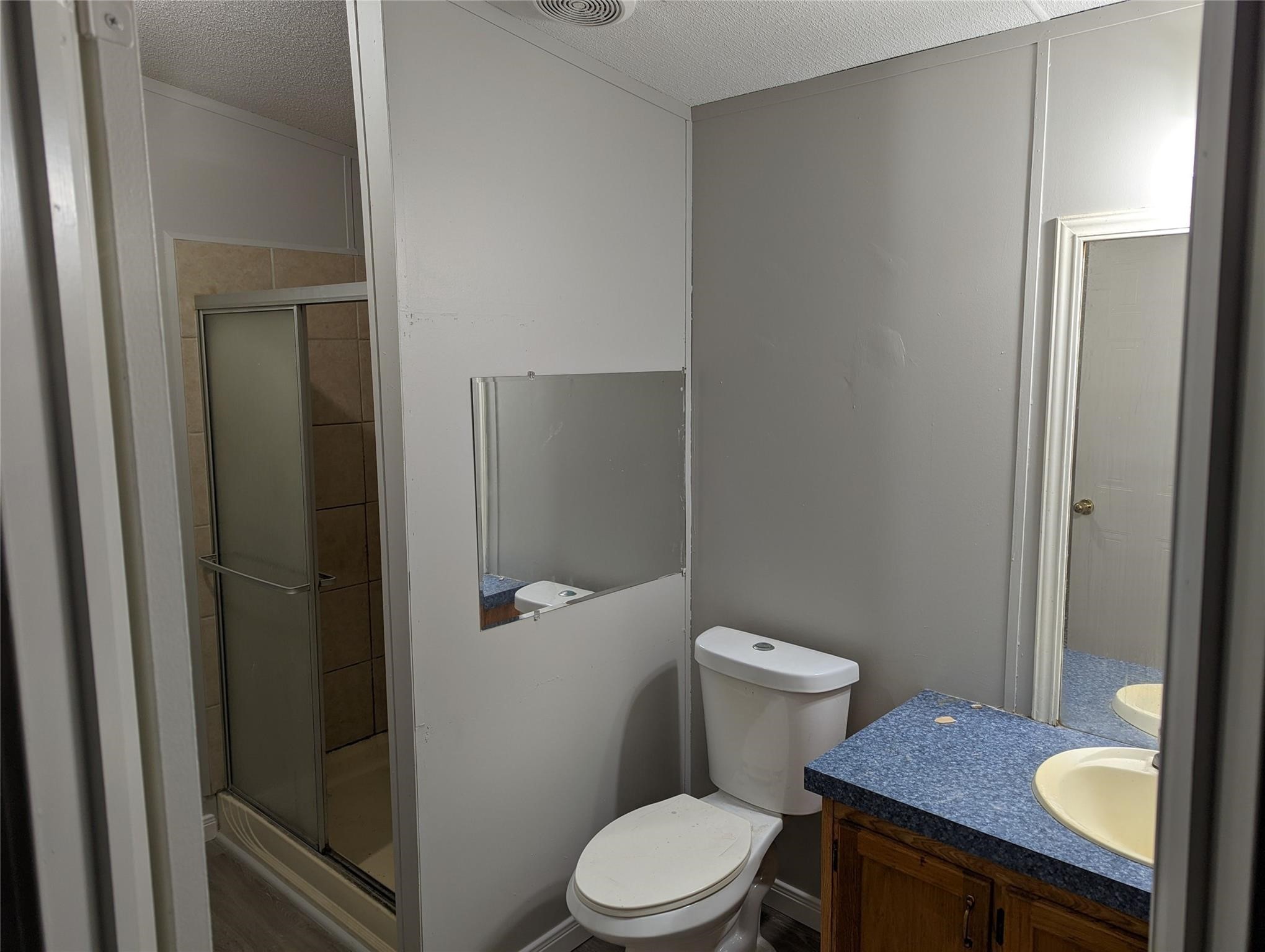 12186 Hairston Circle Willis, TX 77318 - Photo 10 of 16 a white toilet sitting next to a bathroom sink