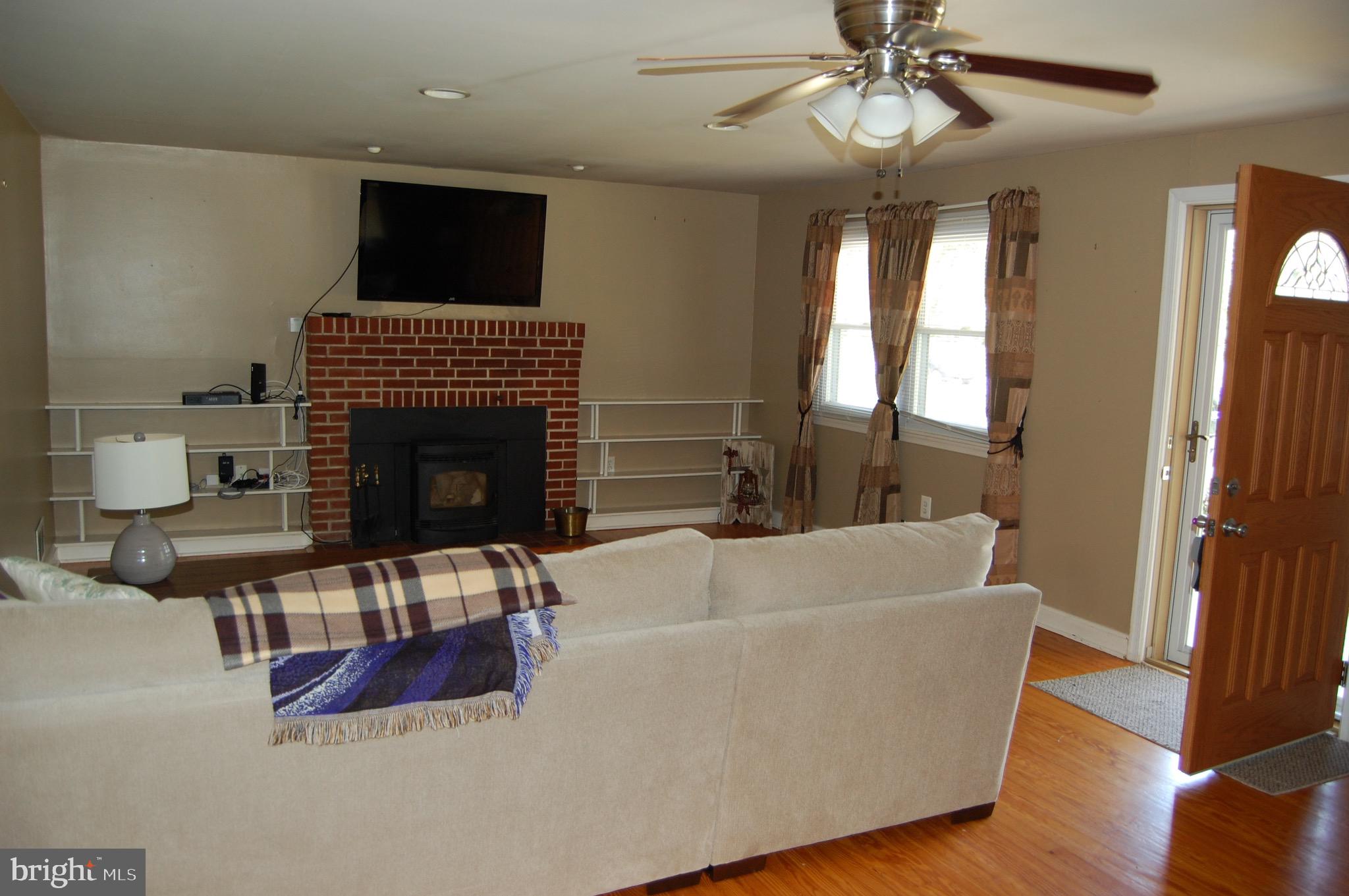 1213 Meadow View Road Pasadena, MD 21122 - Photo 5 of 19 Living Room & Fireplace With Pellet Stove
