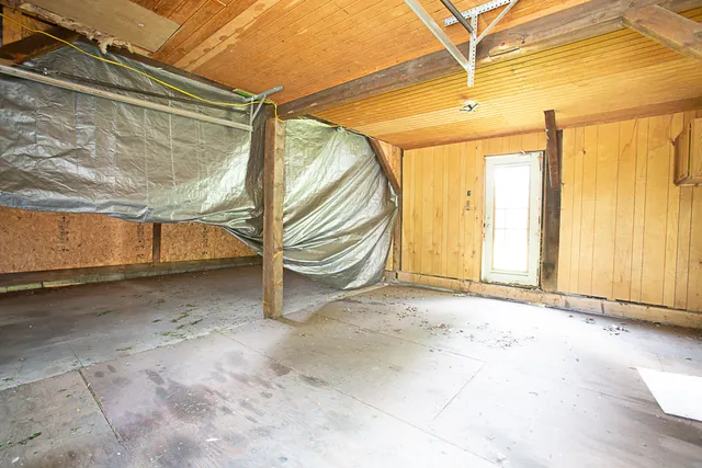 a view of a garage with chairs