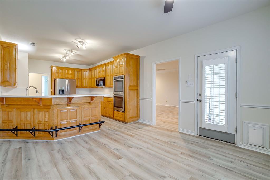 125 View Point Court Aledo, TX 76008 - Photo 17 of 34 a view of kitchen with furniture and wooden floor