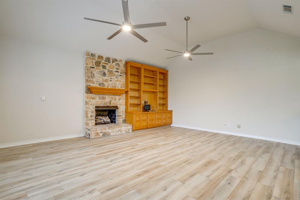 125 View Point Court Aledo, TX 76008 - Photo 20 of 34 a view of an empty room with wooden floor fireplace and a window