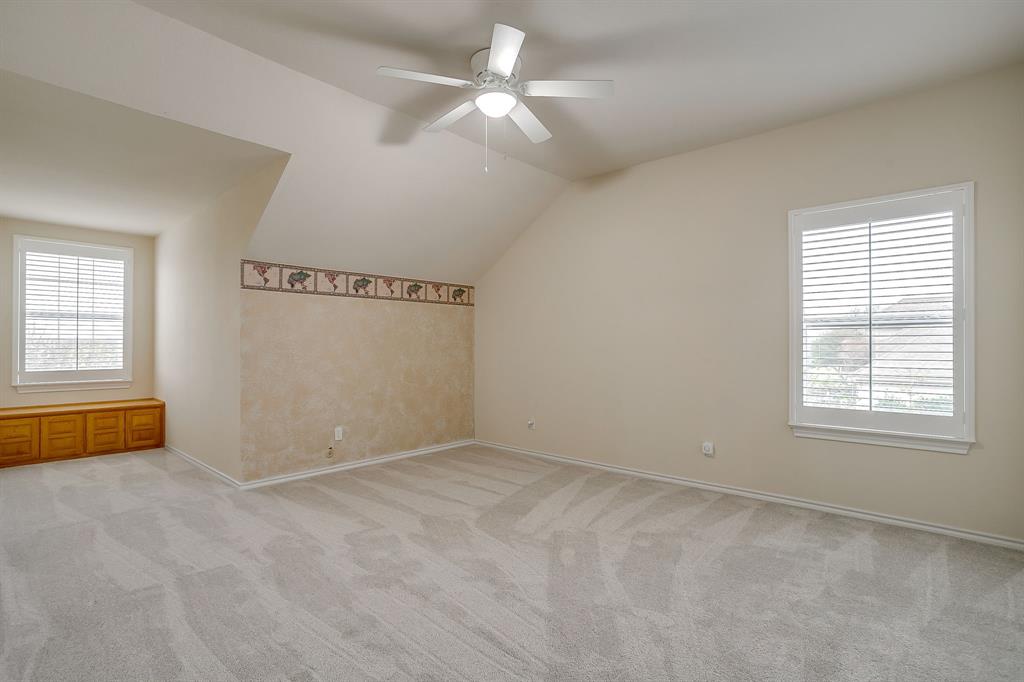 125 View Point Court Aledo, TX 76008 - Photo 22 of 34 an empty room with windows and fan