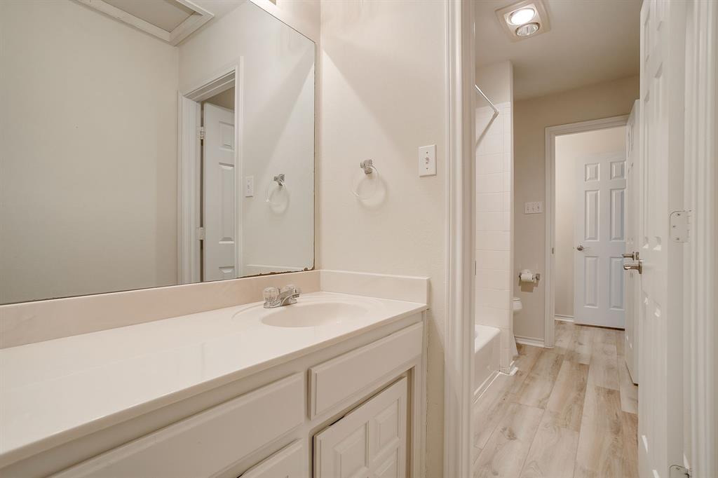 125 View Point Court Aledo, TX 76008 - Photo 23 of 34 a bathroom with a sink and a mirror