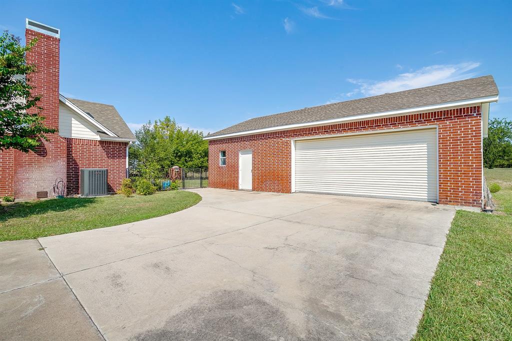 125 View Point Court Aledo, TX 76008 - Photo 29 of 34 a view of backyard of house and garage