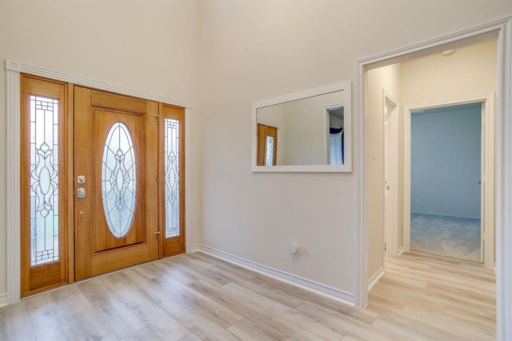 125 View Point Court Aledo, TX 76008 - Photo 6 of 34 an entryway with wooden floor mirror and window