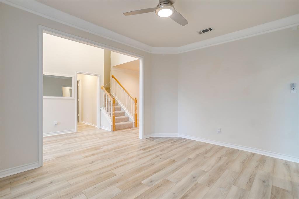 125 View Point Court Aledo, TX 76008 - Photo 9 of 34 a view of an empty room with wooden floor and a window