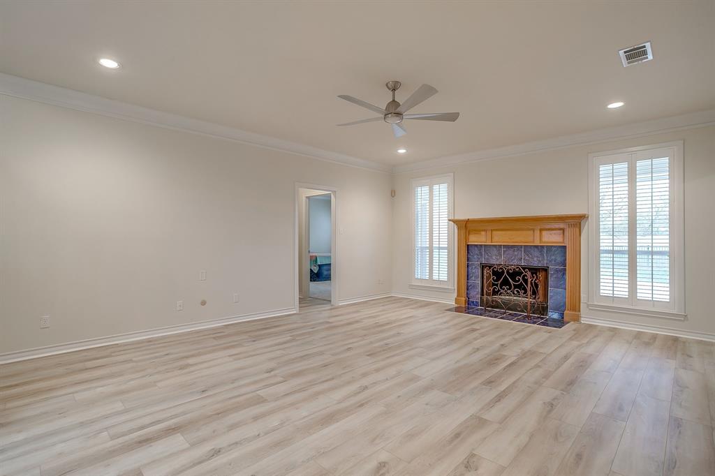 125 View Point Court Aledo, TX 76008 - Photo 10 of 34 an empty room with fireplace wooden floor and windows