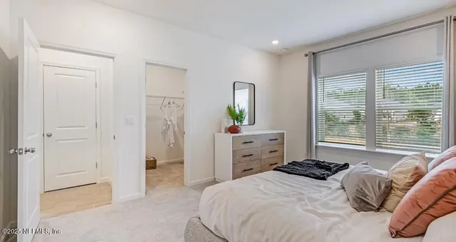 a kitchen with stainless steel appliances kitchen island granite countertop a refrigerator and a stove top oven