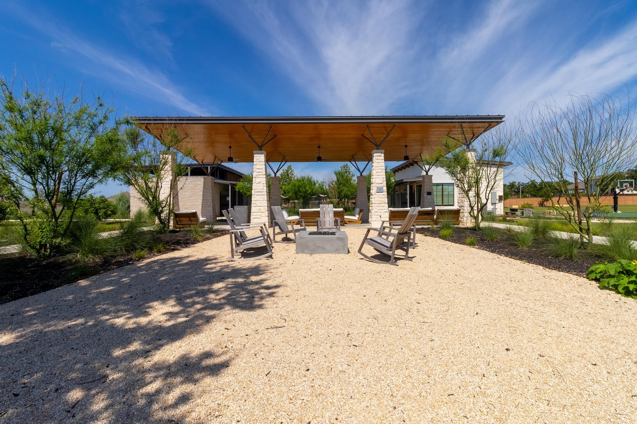 271 Tubman Drive Kyle, TX 78640 - Photo 34 of 40 a view of a patio with a table and chairs under an umbrella