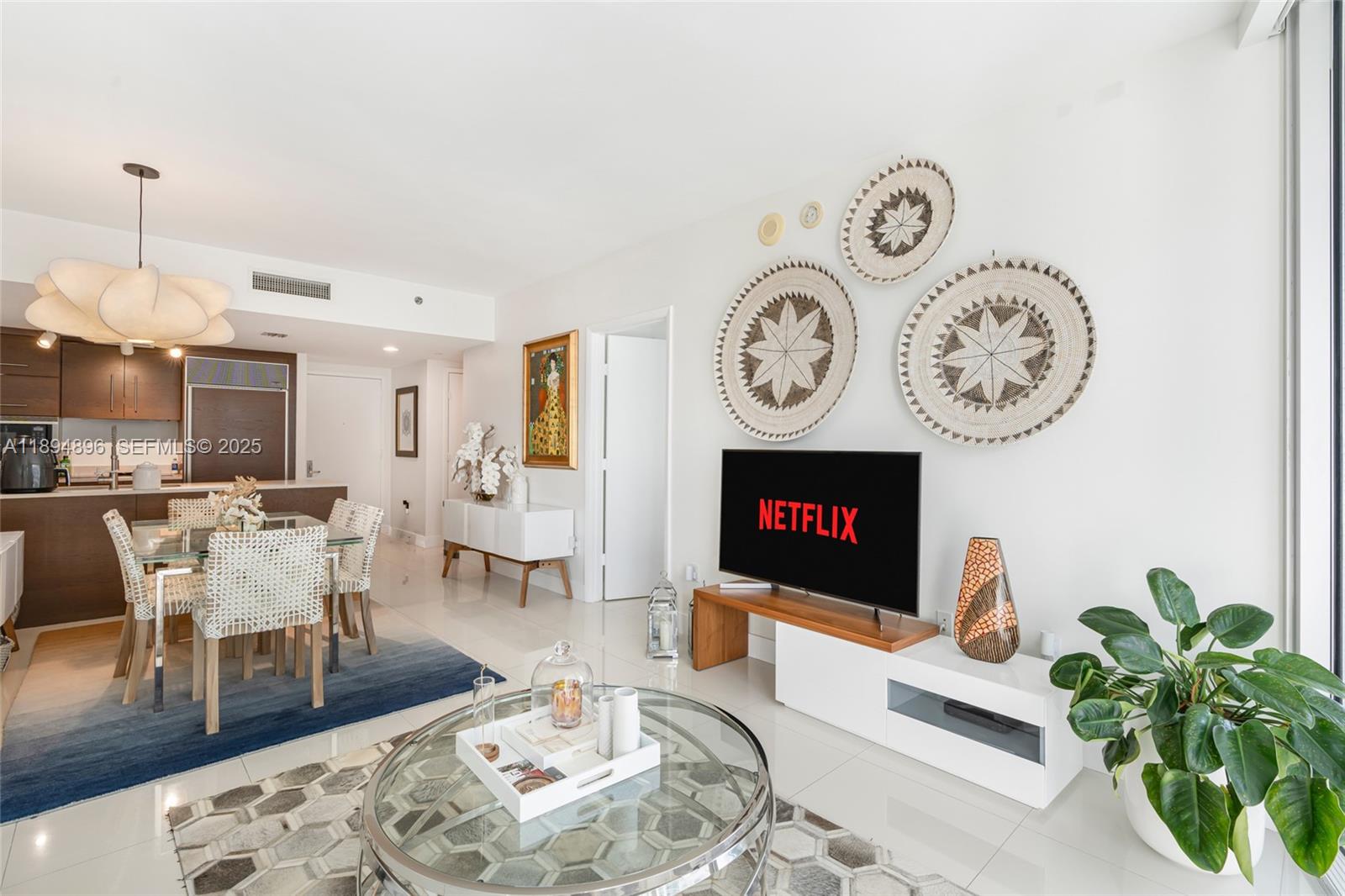 a living room with furniture a clock and a fireplace