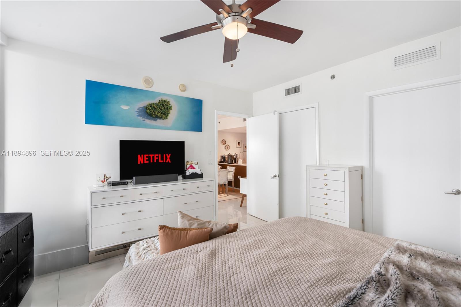 475 Brickell Avenue, Unit 3111 Miami, FL 33131 - Photo 11 of 24 a bedroom with a bed and a flat screen tv