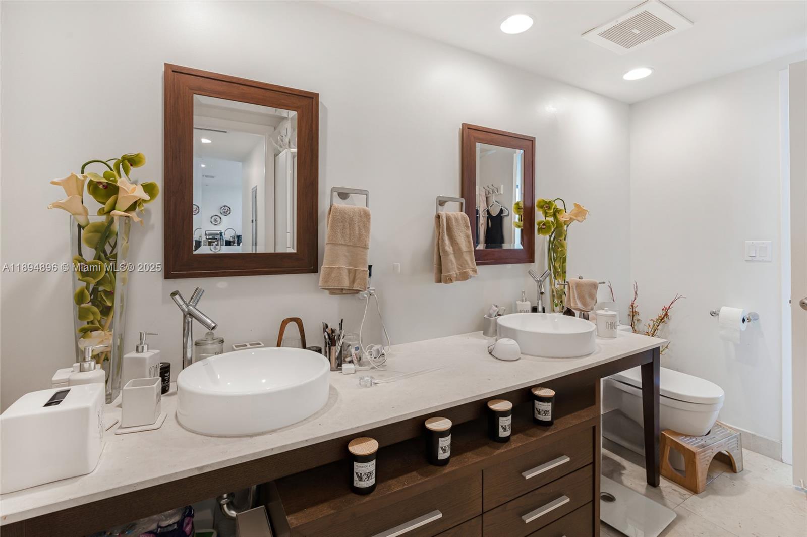 475 Brickell Avenue, Unit 3111 Miami, FL 33131 - Photo 13 of 24 a bathroom with a sink and a mirror