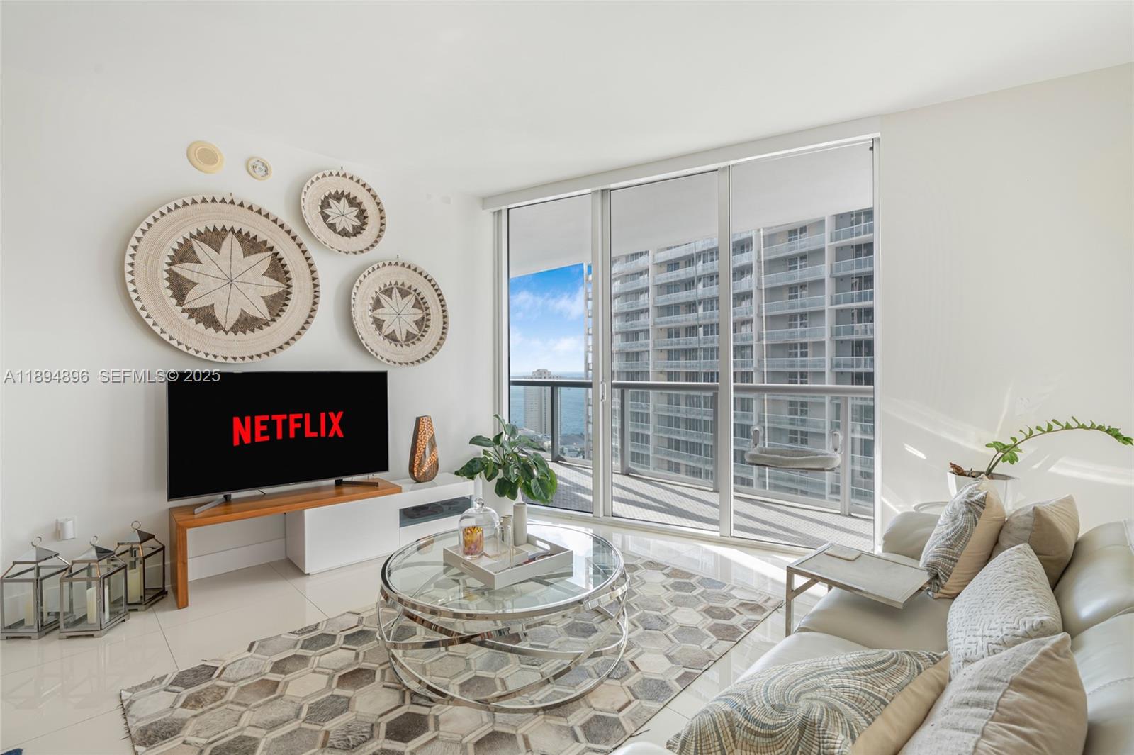 475 Brickell Avenue, Unit 3111 Miami, FL 33131 - Photo 2 of 24 a living room with furniture and a large window