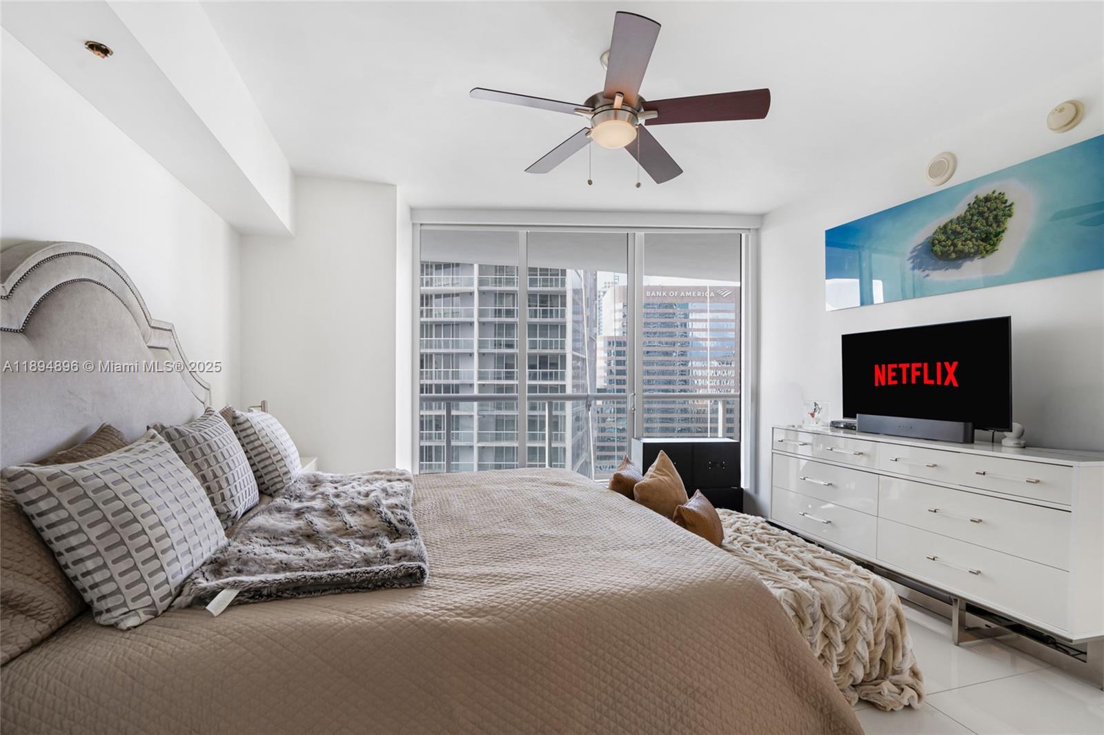 475 Brickell Avenue, Unit 3111 Miami, FL 33131 - Photo 10 of 24 a bedroom with a bed and a flat screen tv