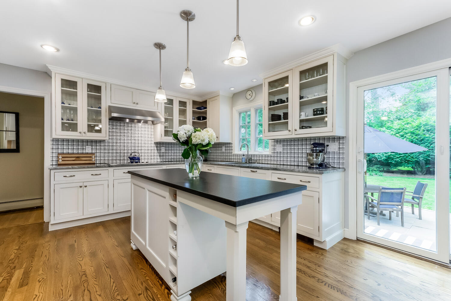 21 Middlesex Road Darien, CT 06820 - Photo 13 of 40 a kitchen with stainless steel appliances granite countertop a sink stove cabinets and wooden floor