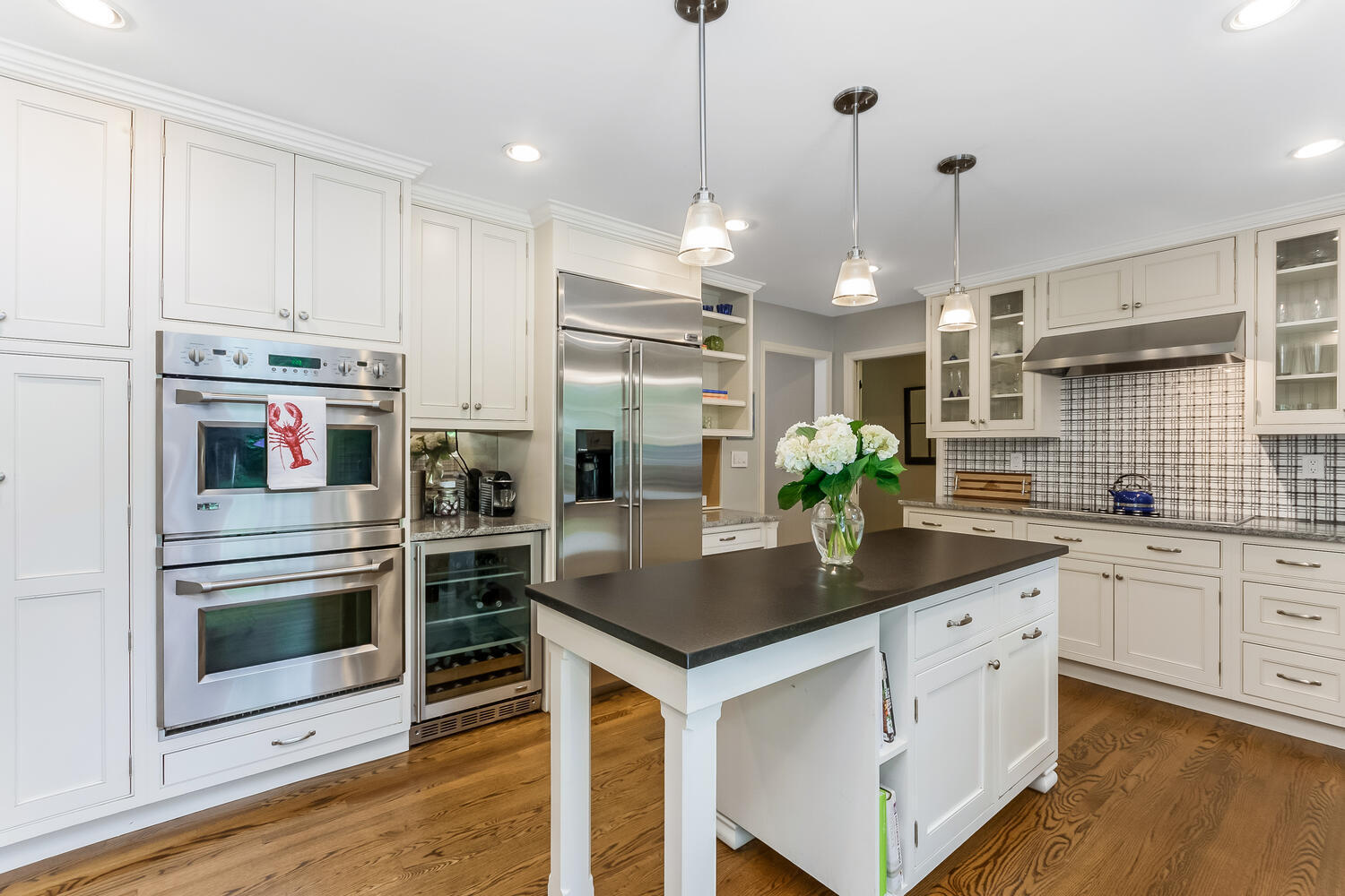 21 Middlesex Road Darien, CT 06820 - Photo 17 of 40 a kitchen with stainless steel appliances kitchen island granite countertop a stove a sink and a refrigerator