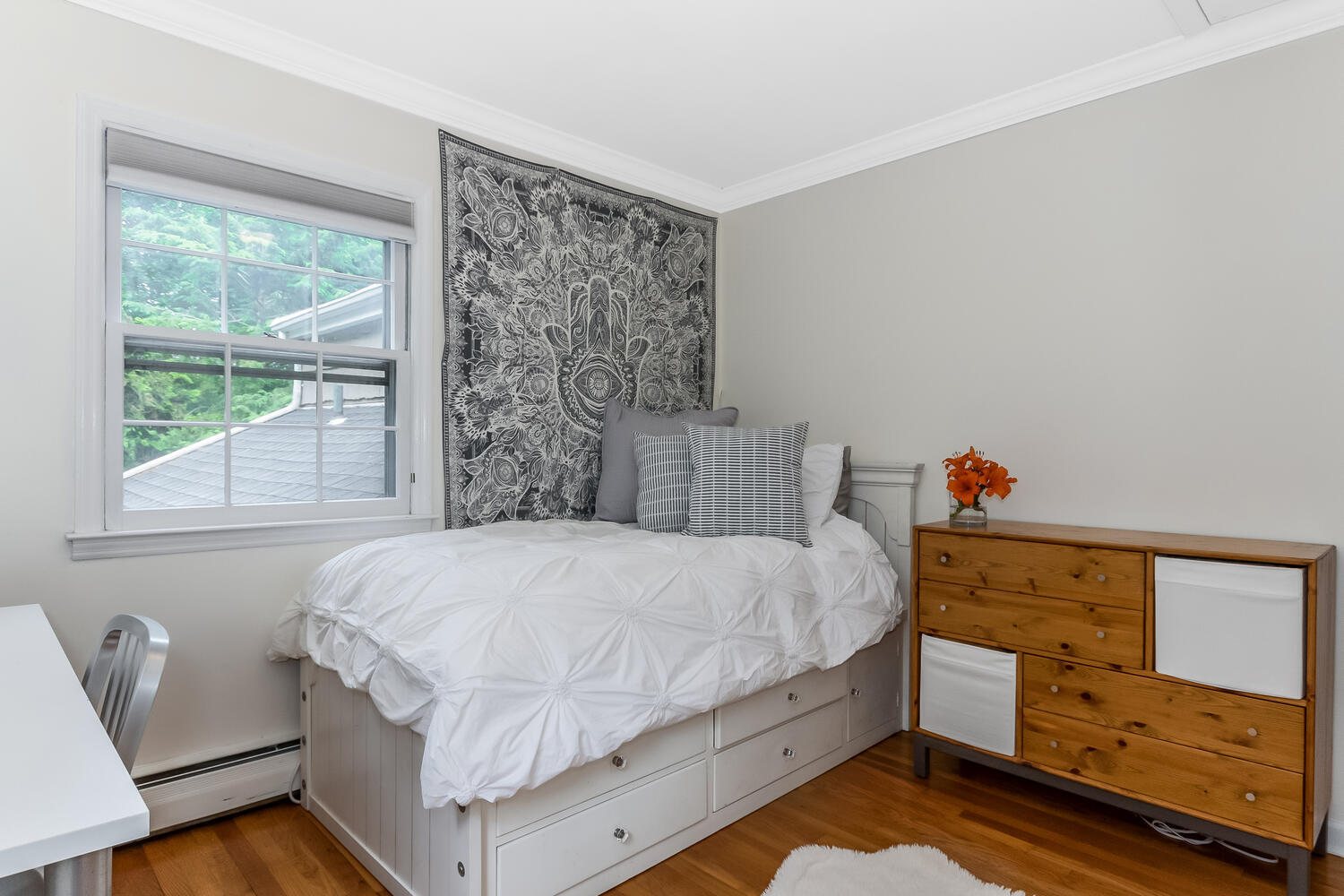 21 Middlesex Road Darien, CT 06820 - Photo 27 of 40 a bedroom with a bed and a window