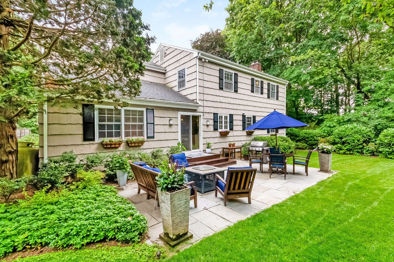 21 Middlesex Road Darien, CT 06820 - Photo 35 of 40 a view of a house with backyard sitting area and garden