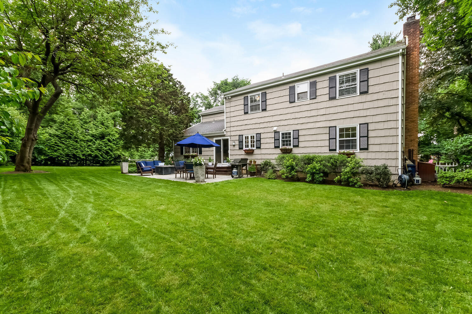 21 Middlesex Road Darien, CT 06820 - Photo 36 of 40 a front view of house with garden and trees