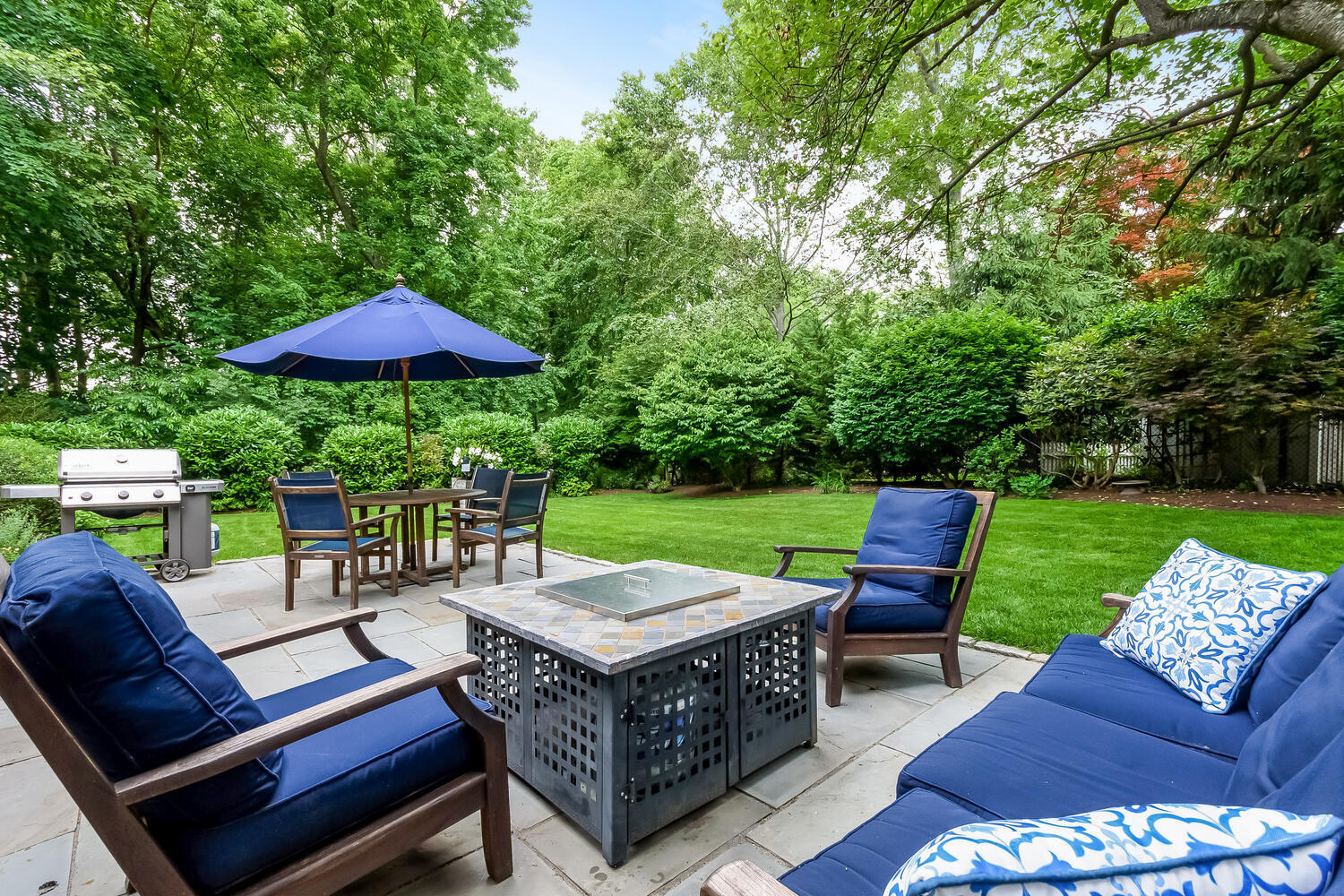 21 Middlesex Road Darien, CT 06820 - Photo 37 of 40 a view of a patio with a yard table and chairs