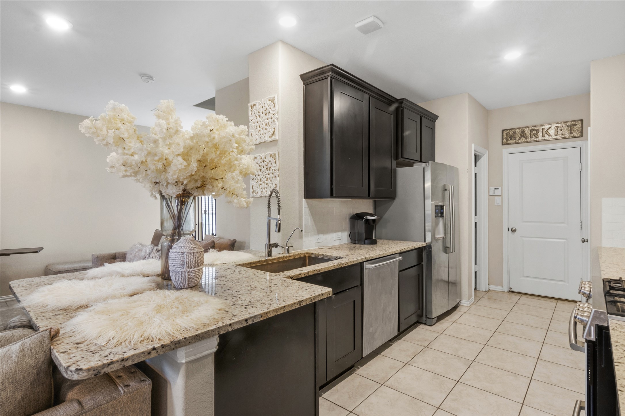 1815 Ryon Falls Drive Richmond, TX 77469 - Photo 10 of 24 a kitchen with stainless steel appliances granite countertop a sink and cabinets