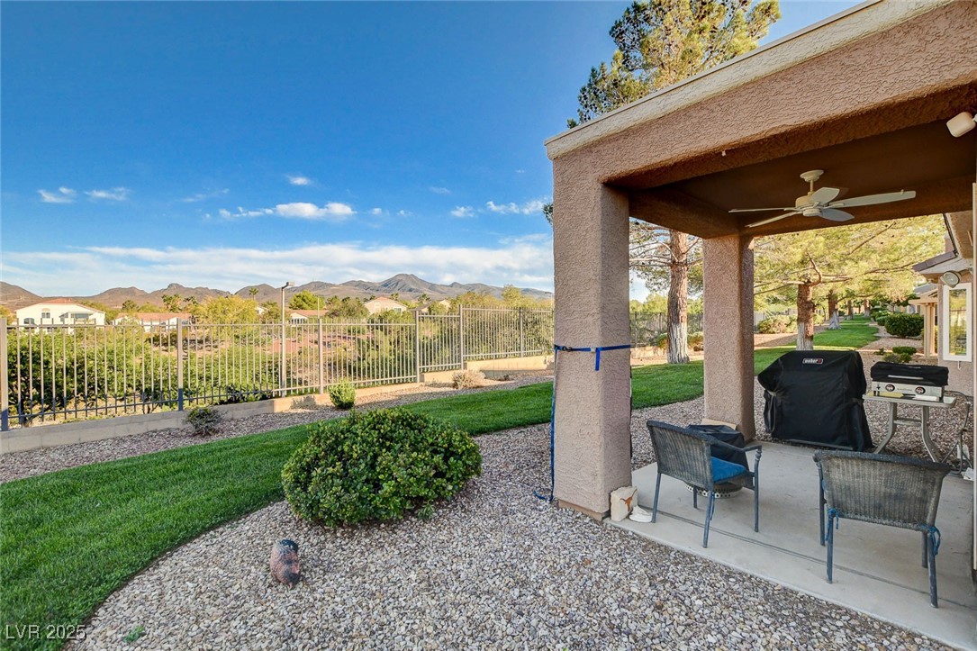 1426 Fieldbrook Street Henderson, NV 89052 - Photo 49 of 60 View of patio with a grill, ceiling fan, and a mountain view