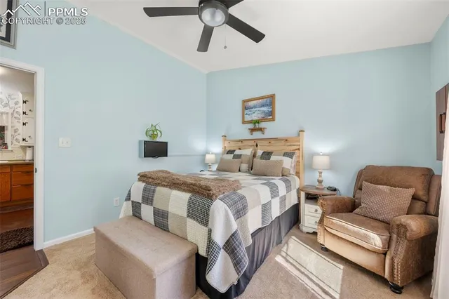 a bedroom with a bed and glass door