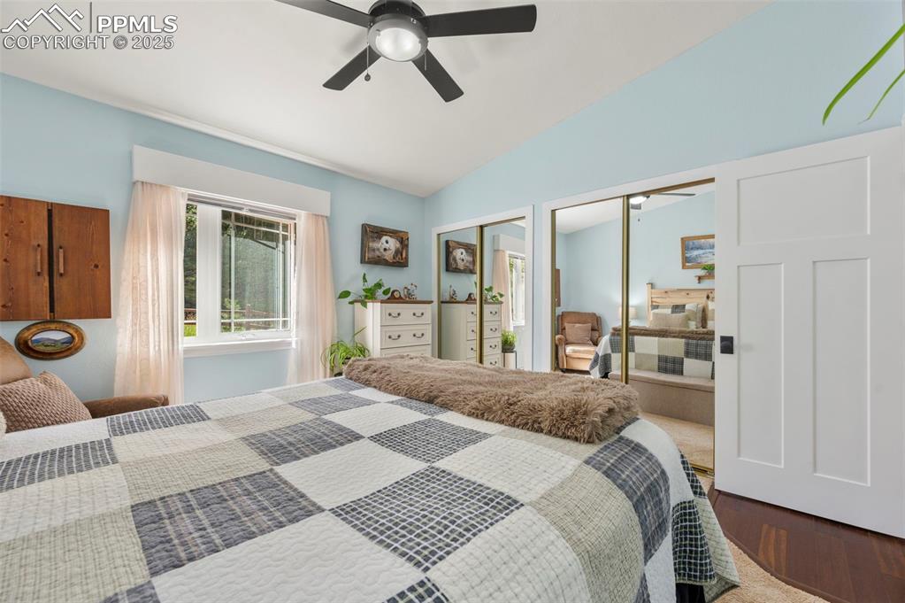 183 Beaver Pond Road Divide, CO 80814 - Photo 16 of 28 a bedroom with a bed and glass door