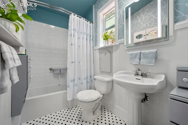 a view of a patio with table and chairs