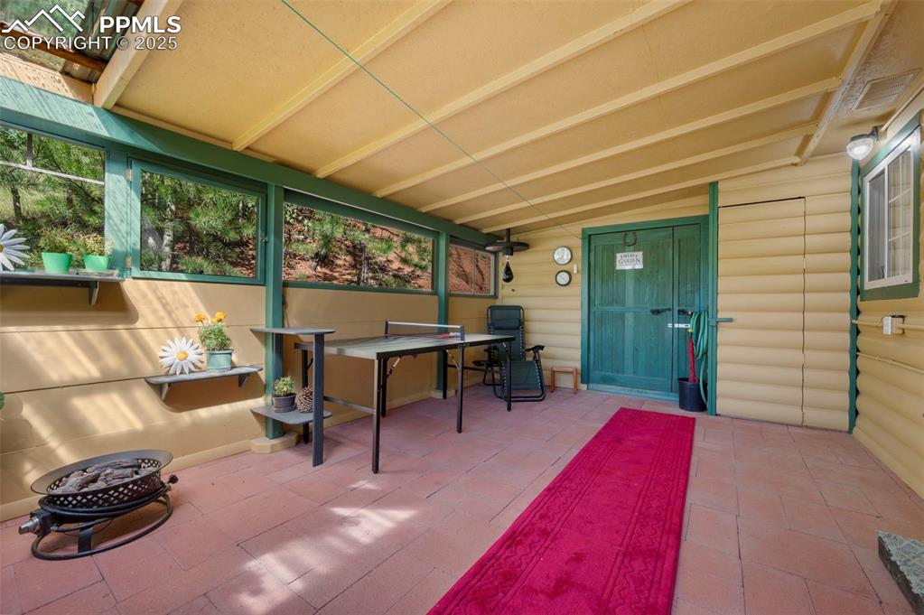 183 Beaver Pond Road Divide, CO 80814 - Photo 18 of 28 a view of a patio with table and chairs