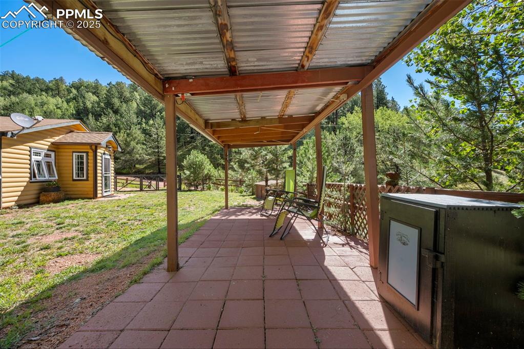 183 Beaver Pond Road Divide, CO 80814 - Photo 23 of 28 a view of a porch with chairs and backyard