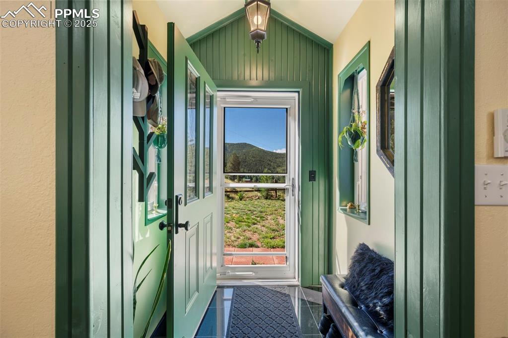 183 Beaver Pond Road Divide, CO 80814 - Photo 4 of 28 a view of a hallway with a glass door
