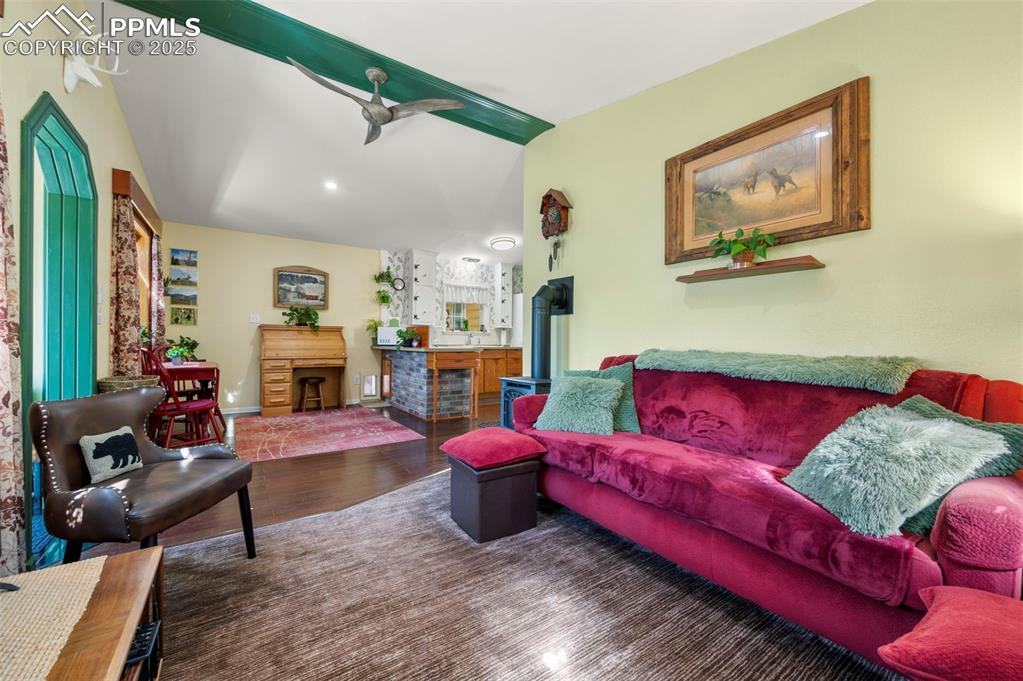 183 Beaver Pond Road Divide, CO 80814 - Photo 7 of 28 a living room with furniture fireplace and a table