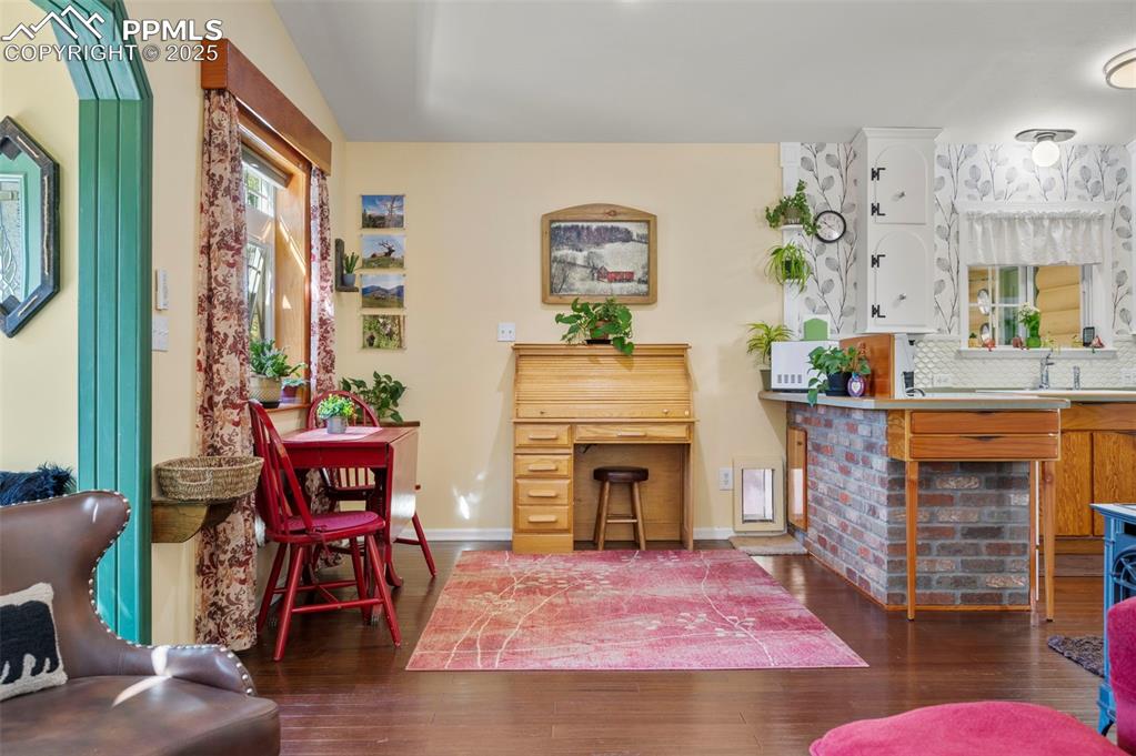 183 Beaver Pond Road Divide, CO 80814 - Photo 8 of 28 a living room with furniture and a fireplace