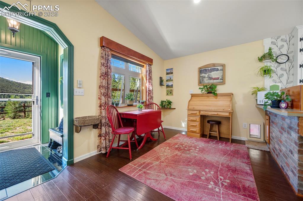 183 Beaver Pond Road Divide, CO 80814 - Photo 9 of 28 a living room with furniture and a fireplace