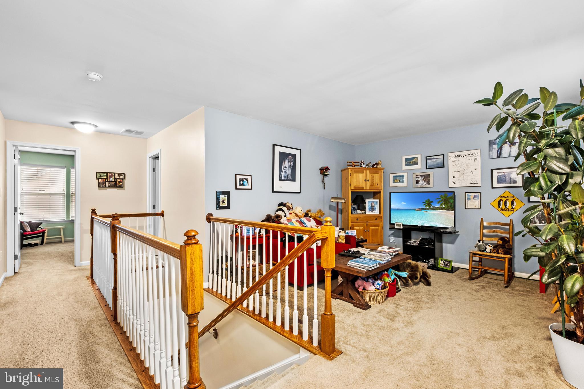 19 Vaughn Way Burlington, NJ 08016 - Photo 20 of 43 a view of a livingroom with furniture and toys