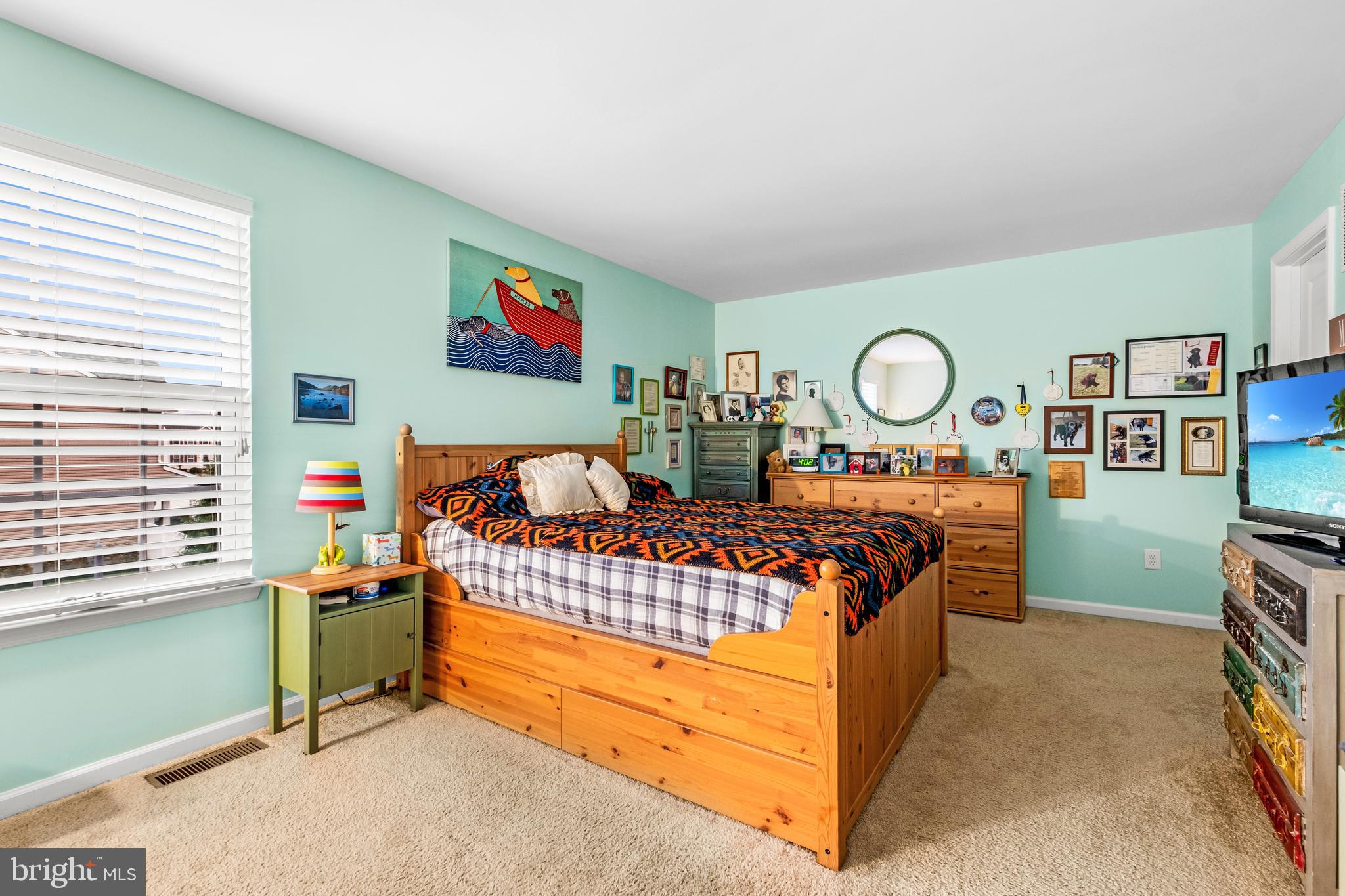 19 Vaughn Way Burlington, NJ 08016 - Photo 23 of 43 a bed room with a bed and paintings on the wall