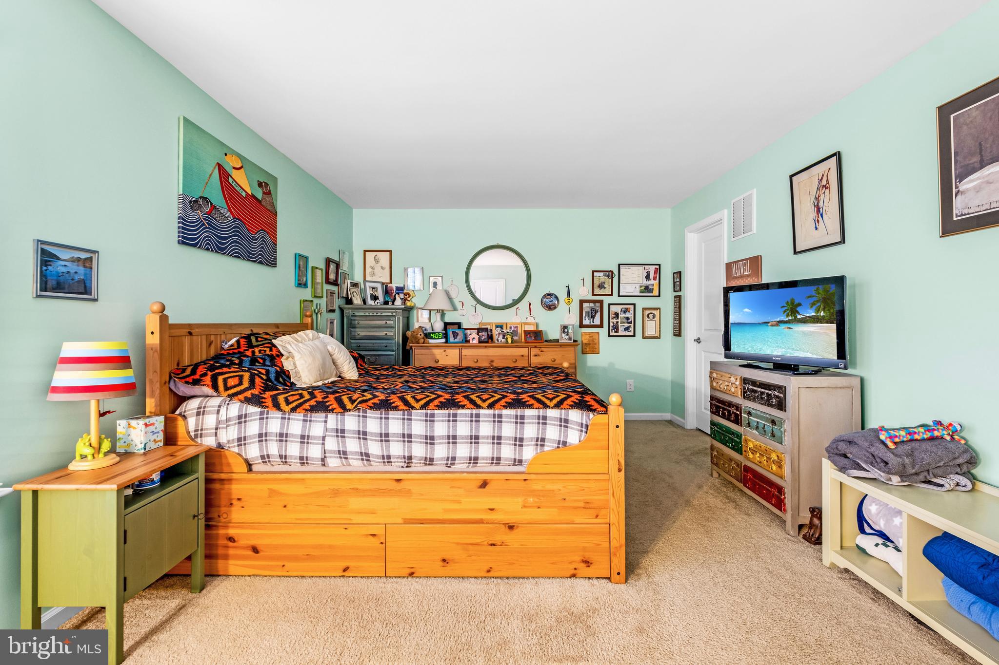 19 Vaughn Way Burlington, NJ 08016 - Photo 24 of 43 a living room with furniture and a flat screen tv