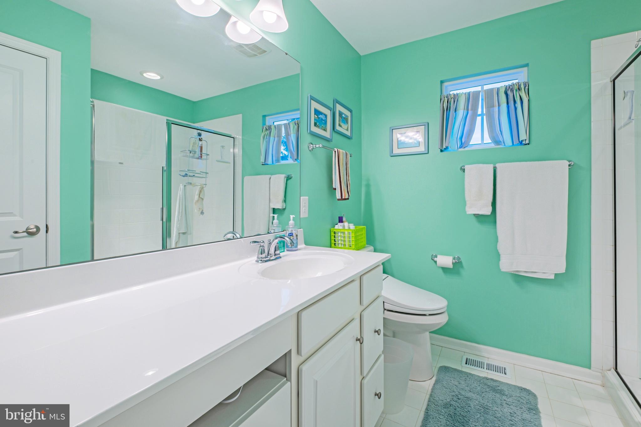 19 Vaughn Way Burlington, NJ 08016 - Photo 25 of 43 a bathroom with a sink a toilet and a mirror