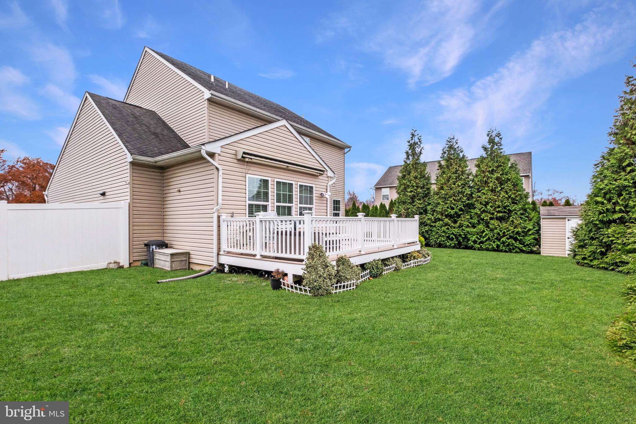 19 Vaughn Way Burlington, NJ 08016 - Photo 36 of 43 a white house with a small yard and big trees