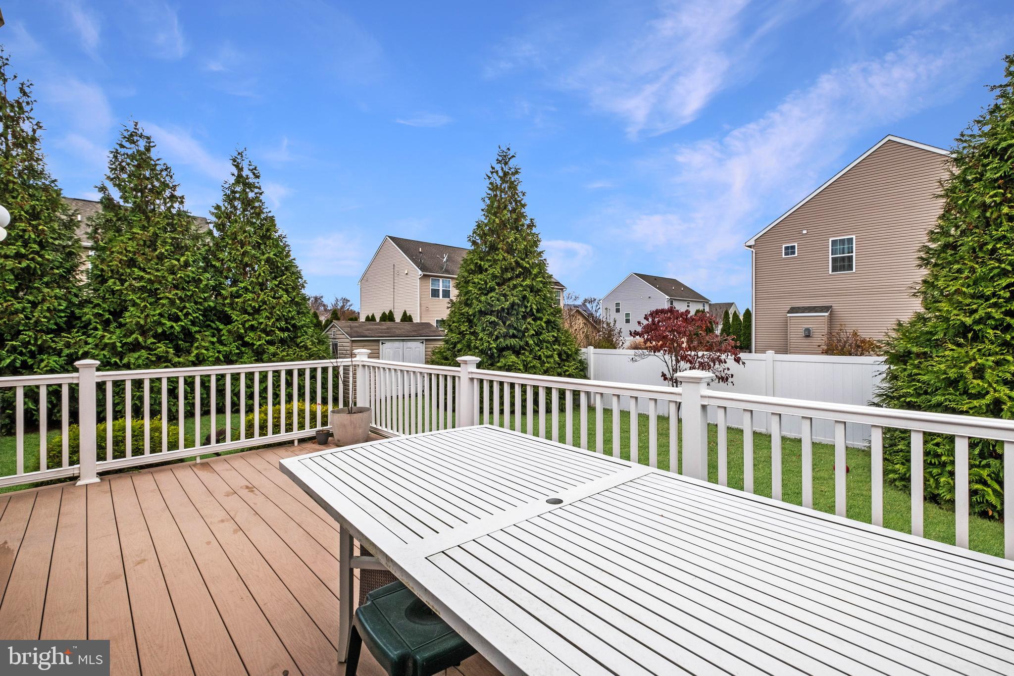 19 Vaughn Way Burlington, NJ 08016 - Photo 38 of 43 a view of a wooden chairs and a bench in the patio